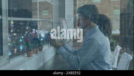 Image of financial data processing over business people using electronic devices Stock Photo