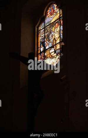 A stained-glass window depicting the blessing of the sick with the Eucharist in the Basilica of Our Lady of the Rosary in Fátima, Portugal. Stock Photo