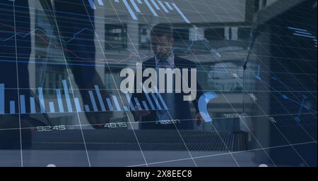 Image of graphs, numbers and loading circles over caucasian businessman moving up on escalator Stock Photo