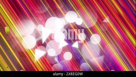 Image of golden confetti falling over spots of light and colorful light trails Stock Photo