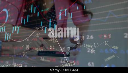 Diverse friends, analyzing stock market trends on smartphone Stock Photo