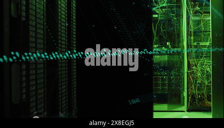 Image of graphs and changing numbers over illuminated data server system in server room Stock Photo