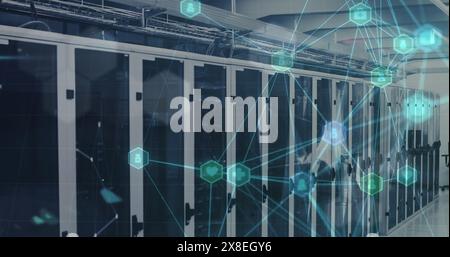 Image of network of medical icons, light spot and plexus networks against computer server room Stock Photo