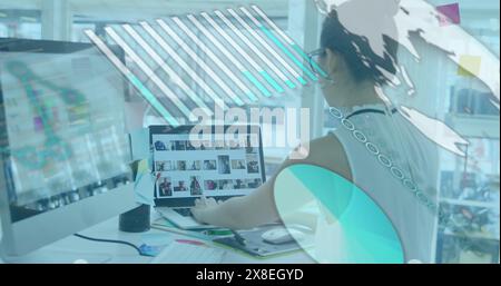 Image of graph, globe and computer language over asian woman working on laptop in office Stock Photo