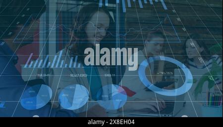 Image of loading circles, graphs, changing numbers, diverse coworkers discussing in office Stock Photo
