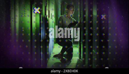 Image of abstract shapes against caucasian female engineer using digital tablet at server room Stock Photo