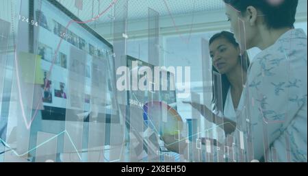 Image of statistical data processing against two diverse female fashion designers discussing Stock Photo