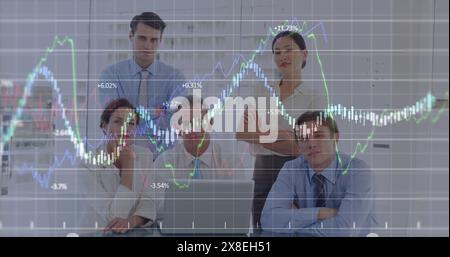 Image of financial data processing against portrait of group of diverse businesspeople at office Stock Photo