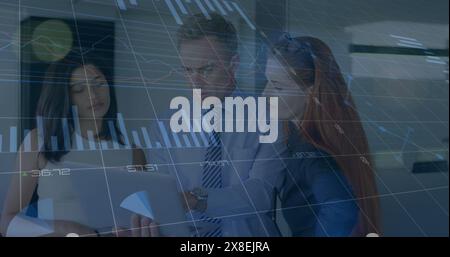 Image of graphs, loading circles and changing numbers, caucasian coworkers discussing in office Stock Photo