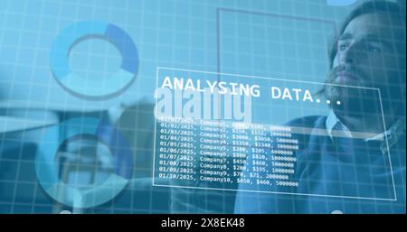 Image of statistical data processing against thoughtful caucasian man at office Stock Photo