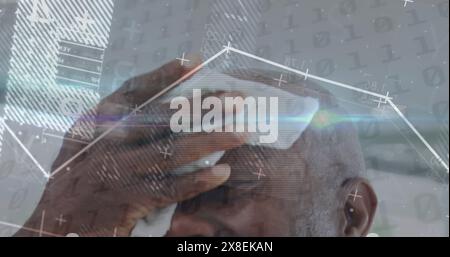 Image of graph, changing numbers, binary codes, african american bald man wiping head Stock Photo