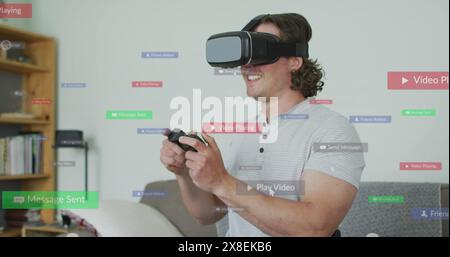 Image of social media data processing over caucasian man using vr headset Stock Photo