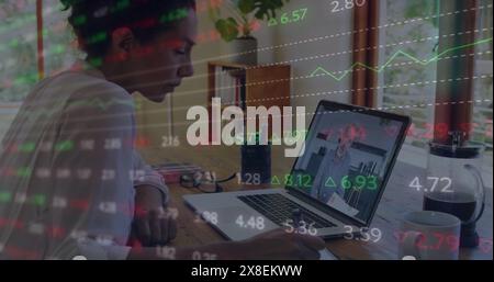 Image of multicolored trading board over diverse coworkers discussing reports on laptop Stock Photo