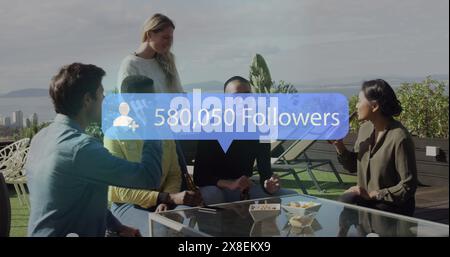 Image of notification bars over diverse friends discussing while drinking beer Stock Photo