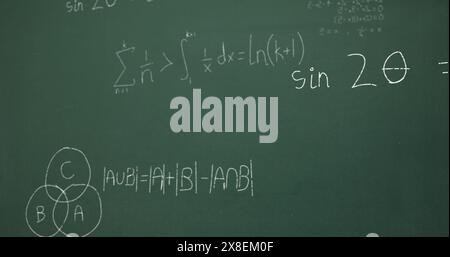 Image of mathematical data processing over green chalkboard Stock Photo