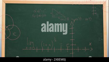 Image of mathematical data processing over green chalkboard Stock Photo
