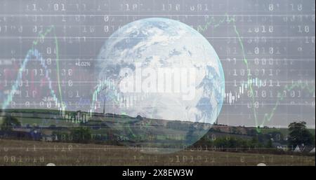 Giant Earth hologram floating above rural landscape, displaying stock market data Stock Photo