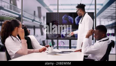 Physician Looking At Shoulder MRT Scan Caucasian Stock Photo