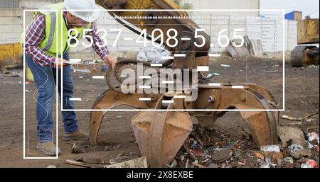 Image of data processing against caucasian male supervisor inspecting hydraulic lifting machine Stock Photo