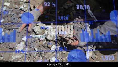 Image of statistical data processing against mid section of male worker working at junkyard Stock Photo