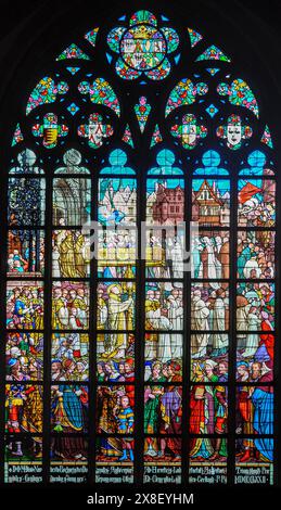 Medieval stained glass window in Antwerp Cathedral, Gothic style Stock Photo