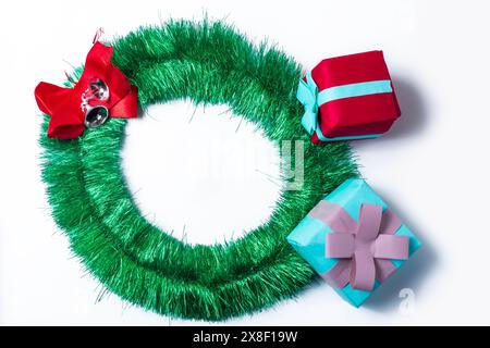 Merry Christmas wreath and gifts isolated on white background. Top view. Stock Photo