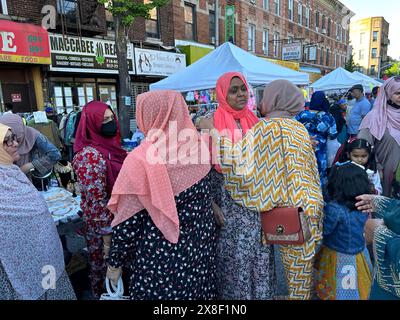 People shopping and socializing at Bangladeshi street fair in the Kensington section of Brooklyn, New York Stock Photo