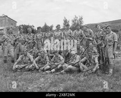 A photograph of the NCO's of No.1 Rifle Company, 3rd Battalion Welsh Guards, 1st Guards Brigade, 6th Armoured Division taken on 11/07/1944 near Cortona. The photograph is marked to the rear with 'August 1944. With compliments of MAJOR R.C. SHARPLES M.C. 3RD BATTLN (sic.) WELSH GUARDS C.M.F.' Stock Photo