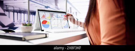 African American Data Analyst Using Data Analytics KPI Dashboard Stock Photo