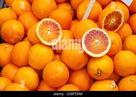 A pile of blood oranges for sale at a market Stock Photo