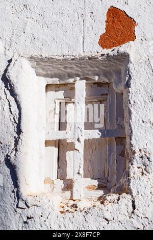 Window in a whitewashed Alhambra façade Stock Photo