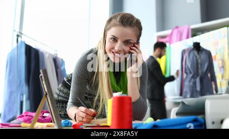 Custom Clothes Tailoring Service Designer on Phone Stock Photo