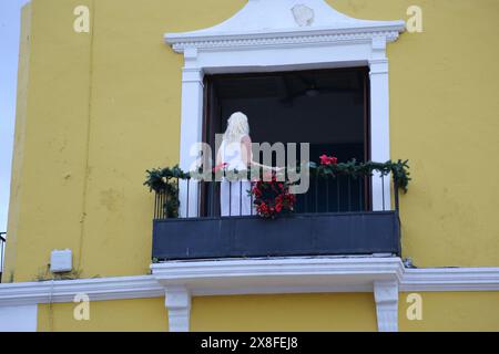 Woman at the balcony in the city of Merida, Mexico Stock Photo