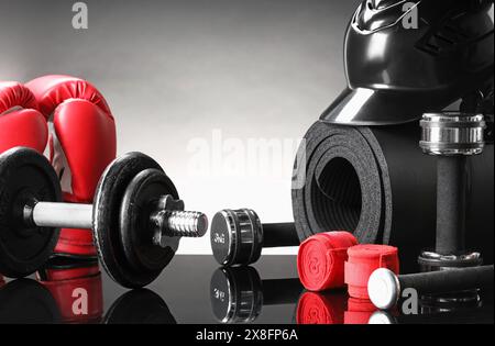 Many different sports equipment on black mirror surface Stock Photo