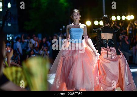 Chengdu, China's Sichuan Province. 24th May, 2024. Models present creations designed by students of Sichuan University and made with technical fabric and low-carbon materials in Chengdu, southwest China's Sichuan Province, May 24, 2024. Credit: Zhang Chaoqun/Xinhua/Alamy Live News Stock Photo