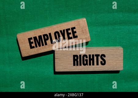 Employee rights words written on wooden blocks with green background. Conceptual employee rights symbol. Copy space. Stock Photo