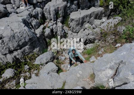 Climbing limestone fissures to Subra peak, Orjen Mountains,  Herceg Novi, Montenegro Stock Photo