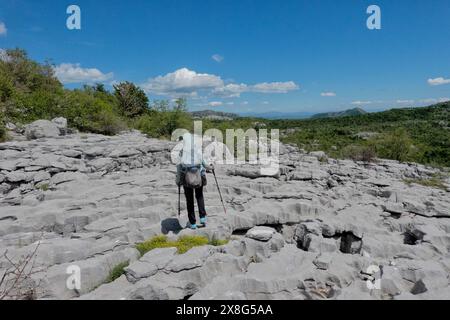 Climbing limestone fissures to Subra peak, Orjen Mountains,  Herceg Novi, Montenegro Stock Photo