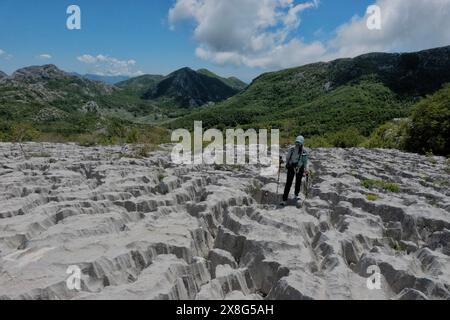 Climbing limestone fissures to Subra peak, Orjen Mountains,  Herceg Novi, Montenegro Stock Photo