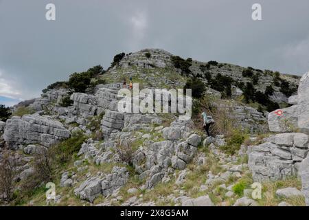 Climbing limestone fissures to Subra peak, Orjen Mountains,  Herceg Novi, Montenegro Stock Photo