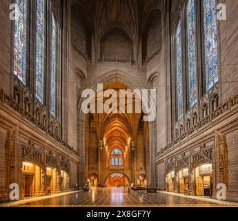 Interior view of the central space and nave and large stained glass windows of Liverpool Cathedral, Liverpool, Merseyside, UK on 22 May 2024 Stock Photo