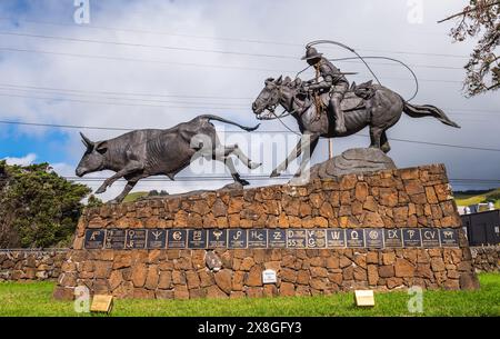 Hawaii, HI USA - October 29, 2016: Bronze statue of Hawaiian Cowboy and steer with local ranch brands, symbol of Hawaiian paniolo pride. Stock Photo