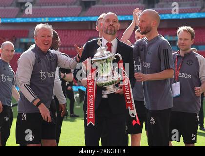 London, UK. 25th May, 2024. Erik ten Hag manager of Manchester United and his coaching staff with the trophy during the The FA Cup match at Wembley Stadium, London. Picture credit should read: David Klein/Sportimage Credit: Sportimage Ltd/Alamy Live News Stock Photo