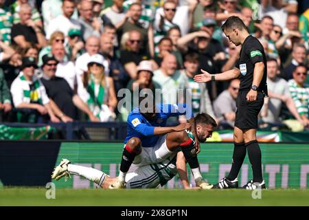 Rangers' Dujon Sterling sits on the back of Celtic's Greg Taylor ...
