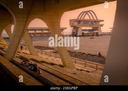 The local man sleeping on the Independence Square (Black Star Square) in the city center of Accra, the capital of Ghana (West Africa) Stock Photo