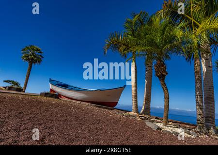 Cliffs in Tenerife Los Gigantes panorama with fishing boat instagram place Stock Photo