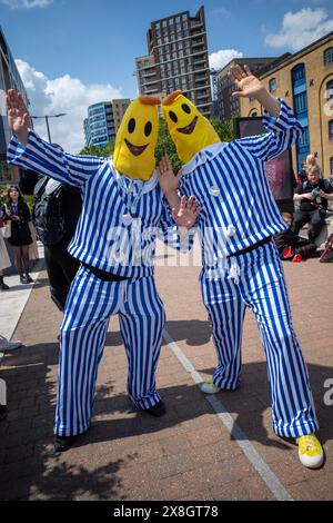 London, UK, 25th May, 2024. Two people dressed as Bananas in pyjamas attend Comic Con London.  Credit: James Willoughby/Alamy Live News Stock Photo