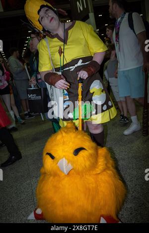 London, UK, 25th May, 2024. A visitor to Comic Con London wheels a puppet bird through the Excel exhibition centre. Credit: James Willoughby/Alamy Live News Stock Photo