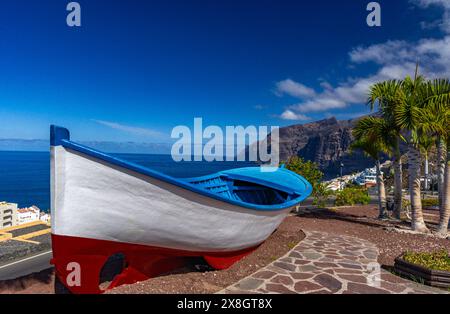 Cliffs in Tenerife Los Gigantes panorama with fishing boat instagram place Stock Photo