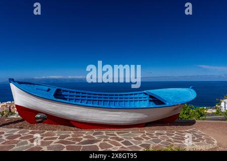 Cliffs in Tenerife Los Gigantes panorama with fishing boat instagram place Stock Photo